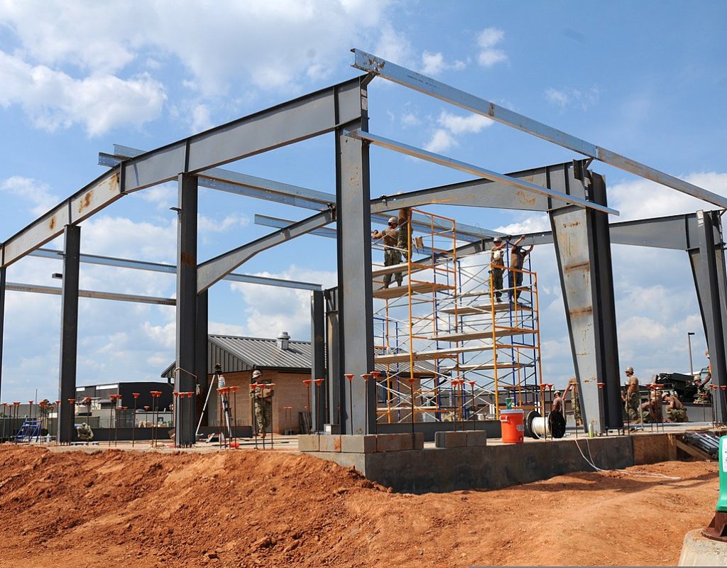 U.S. Sailors assigned to Naval Mobile Construction Battalion 11 construct a pre-engineered building for the technical trainer at the Naval Construction Battalion Center in Gulfport, Miss., May 8, 2013. (U.S. Navy photo by Mass Communication Specialist 1st Class Jonathan Carmichael/Released)